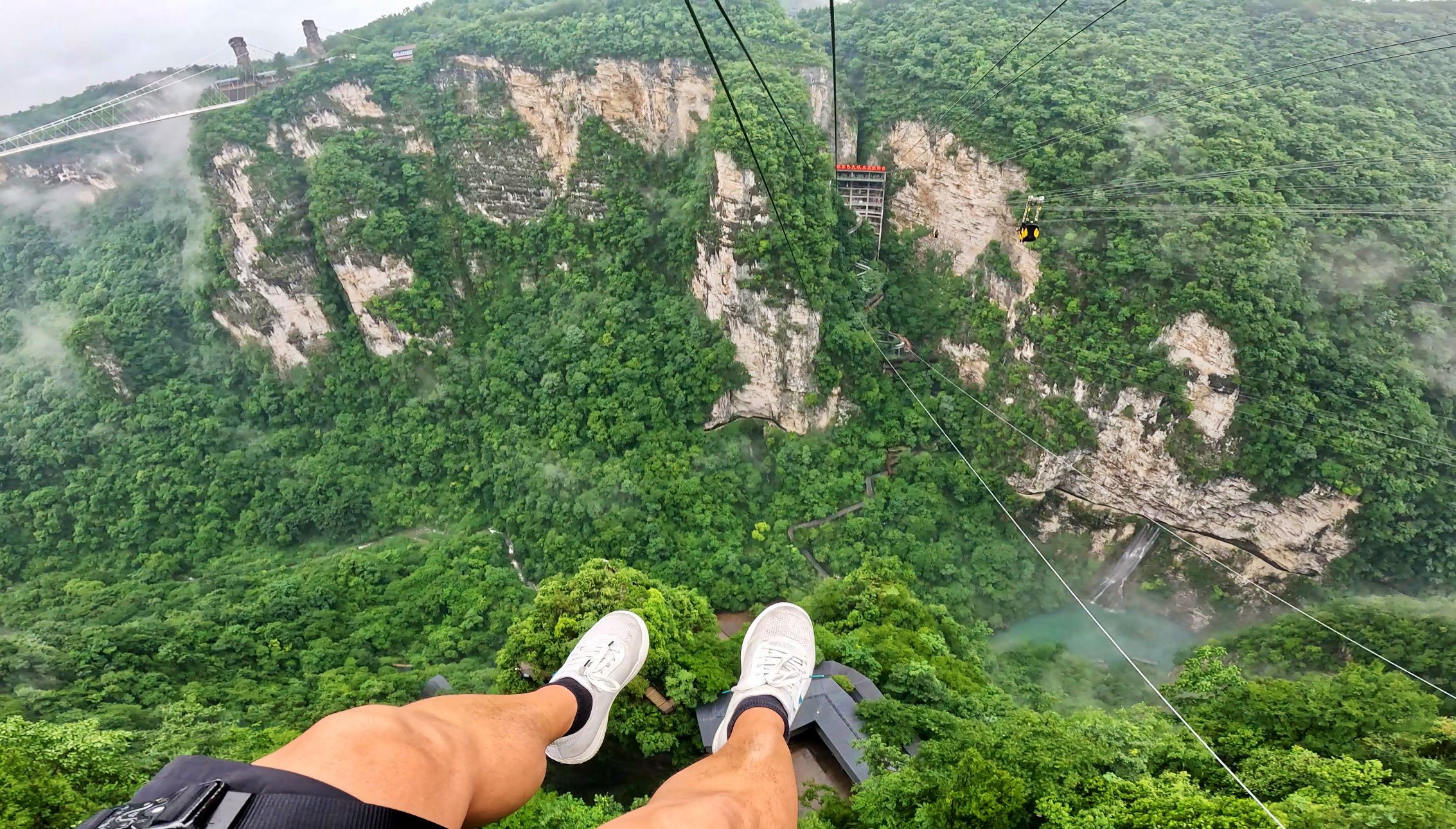 Attractions 360° on X: "Visited the Zhangjiajie Grand Canyon Glass Bridge. It's the 2nd longest & highest glass bridge in the world at 1,410ft long & 980ft high. 🇨🇳⛰️ We also zip