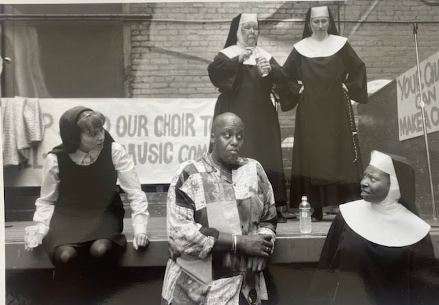 RealBillDuke's tweet photo. On this Throwback Thursday, here's some set photos from Sister Act 2:Back in Habit with Bill in his Director's mode, chatting with #WhoopiGoldberg, #SherylLeeRalph and being the consummate professional he is. 
#realbillduke #SisterAct2 #director #film #kathynajimy #MaggieSmith https://t.co/3nuYduuRzf