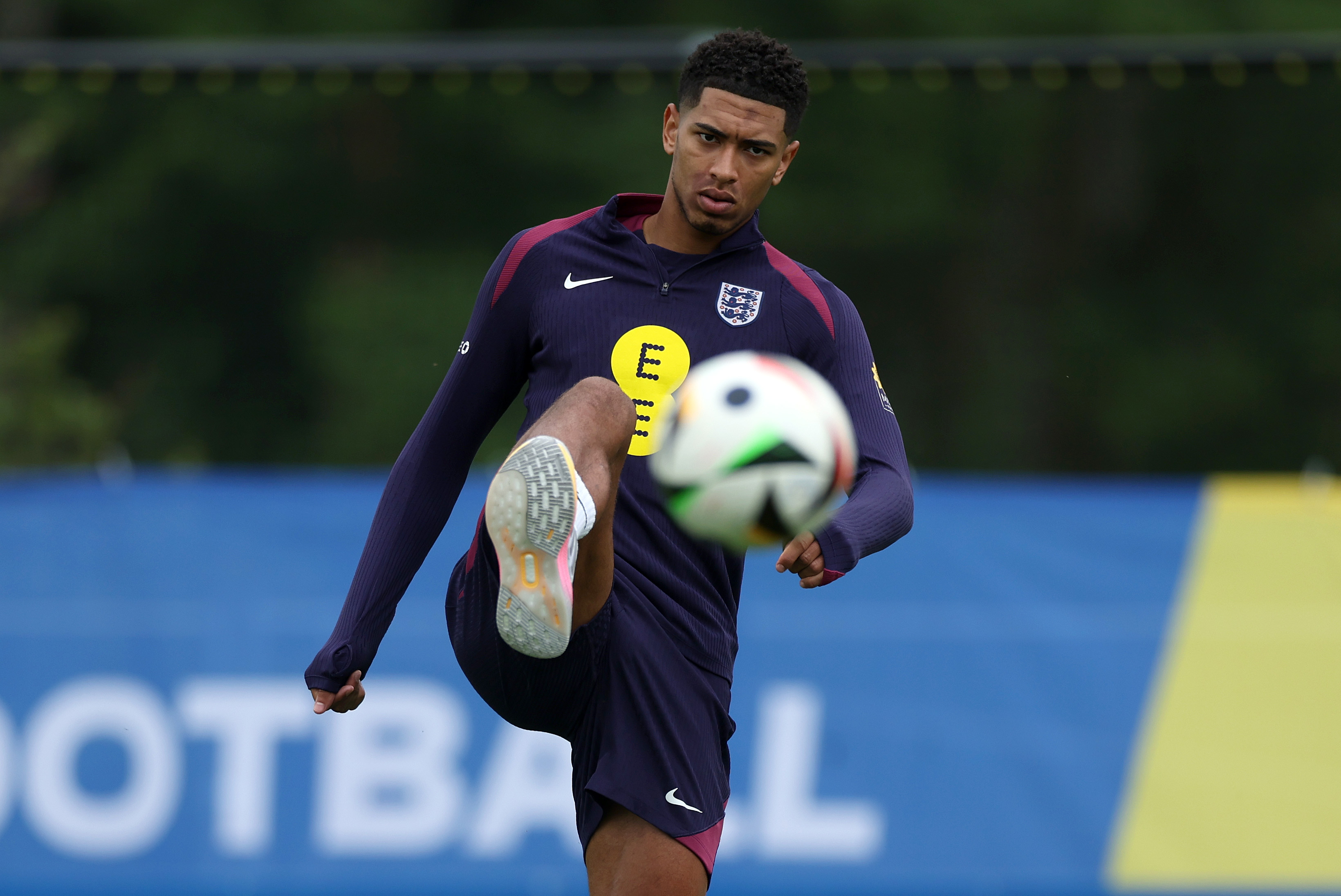 Jude Bellingham kicks a ball in training.