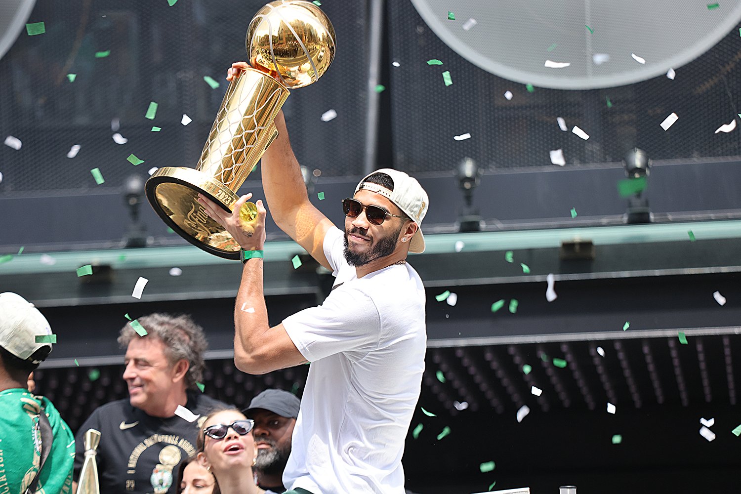 Jayson Tatum celebrates during the duck boat parade for the 2024 NBA Champion Boston Celtics.