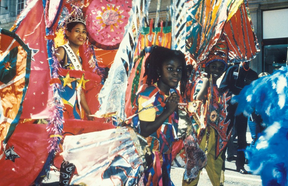Today, on Windrush Day, we celebrate the amazing social and cultural contributions that the Windrush generation and their descendants have made to our city.

To those who made Manchester their home, thank you.

📸 Moss Side Carnival, 1975-1977, <a href="/archivesplus/">Archives+</a> 

#WindrushDay