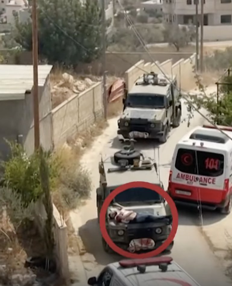 The Israeli Terrorist Forces tied a Palestinian civilian to their armed vehicle and used him as a human shield 
القوات الإسرائيلية الإرهابية قامت بربط مدني فلسطيني بمركبتهم  واستخدامه كدرع بشري.

#GazaGenocide‌ #FREEPALESTİNE #IsraelIsATerroristState‌ #gazaholocost