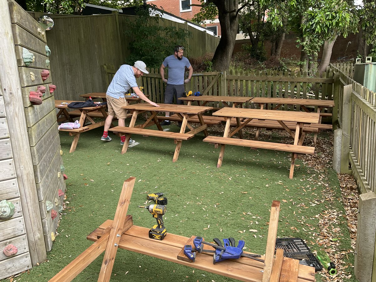 Look what this amazing team of family volunteers did this morning!

10 picnic tables assembled. One climbing wall taken down. A new outdoor classroom and chill out zone ready to use on Monday! 

(Benches funded by PTA).