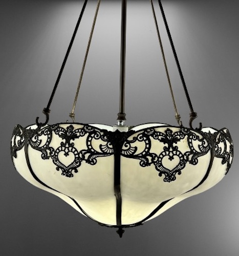 Exquisite C. 1910 White Slag Glass Inverted Dome with Relief Cast Detail. Featuring stylized medallions that add a touch of sophistication and charm. The bulbous shape of the dome creates a captivating visual appeal.  genuineantiquelighting.net/pc/JI1/3382d/W…