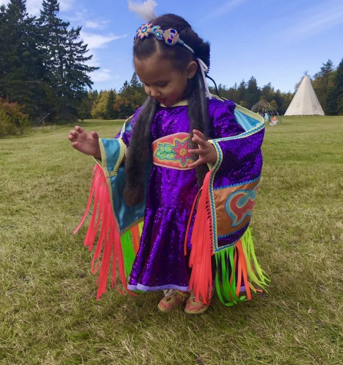 Little powwow dancer in her powwow regalia. She’s absolutely adorable — agree?