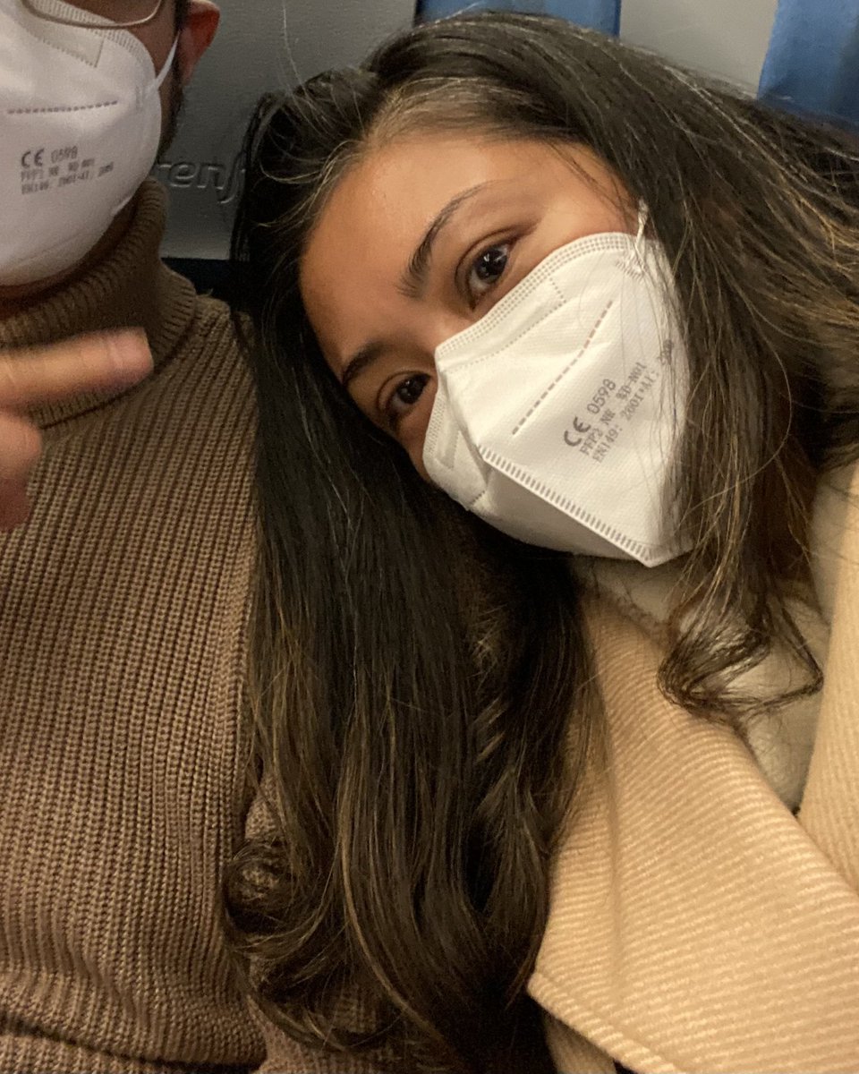 Man and woman (my spouse and I) wearing FFP2 respirators