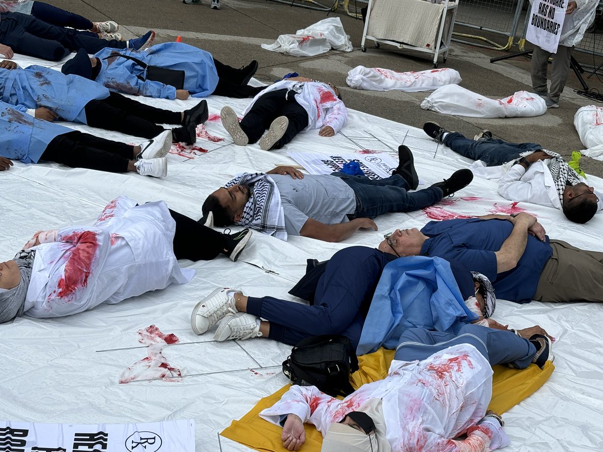 ItisMoody's tweet photo. Today we had our Healthcare workers die-in for #Gaza in #Toronto! Some of the most amazing, brilliant, inspiring, and brave healthcare workers in #Canada. Despite the rain and some other minor nuisances, the event was truly powerful! https://t.co/GzUvf8uAa2