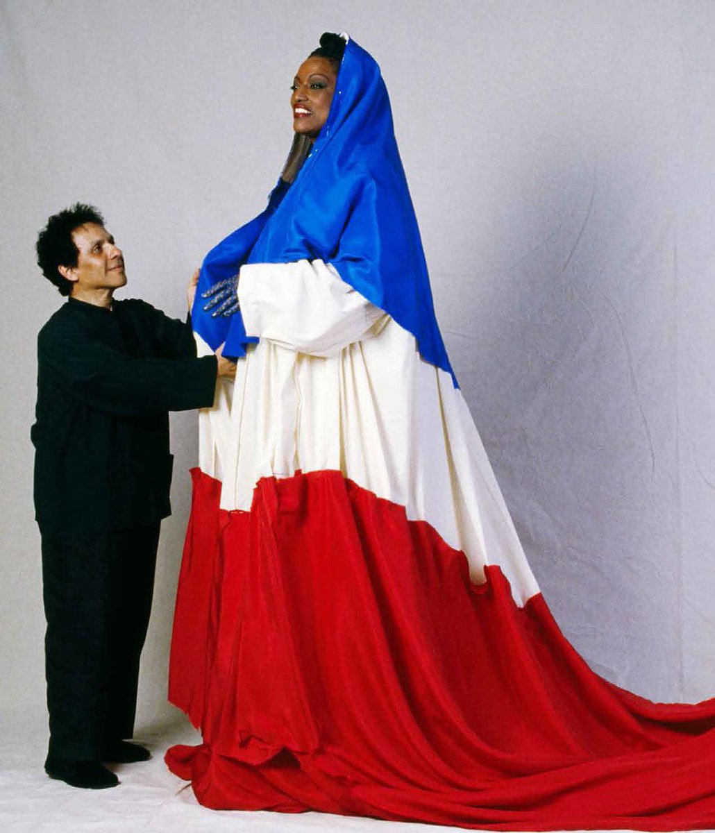 Anok Yai wearing custom Azzedine Alaïa by Peter Mulier at Vogue World 2024. This look references Jessye Norman's custom Alaïa French tri-color gown, worn at Place de la Concorde in Paris in 1989