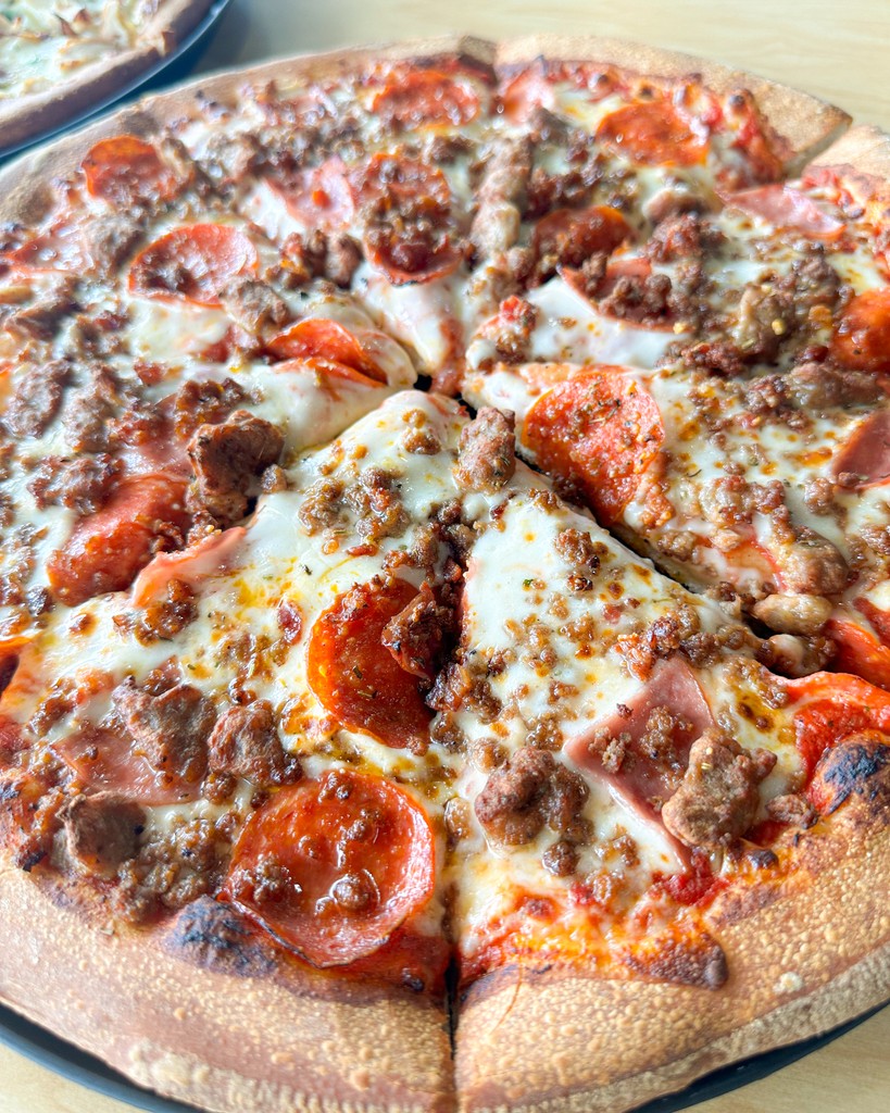 Mondays after a holiday weekend are tough, but our 5-Meat Carnes pizza is tougher. 💪 Let us be your perfect pick-me-up!