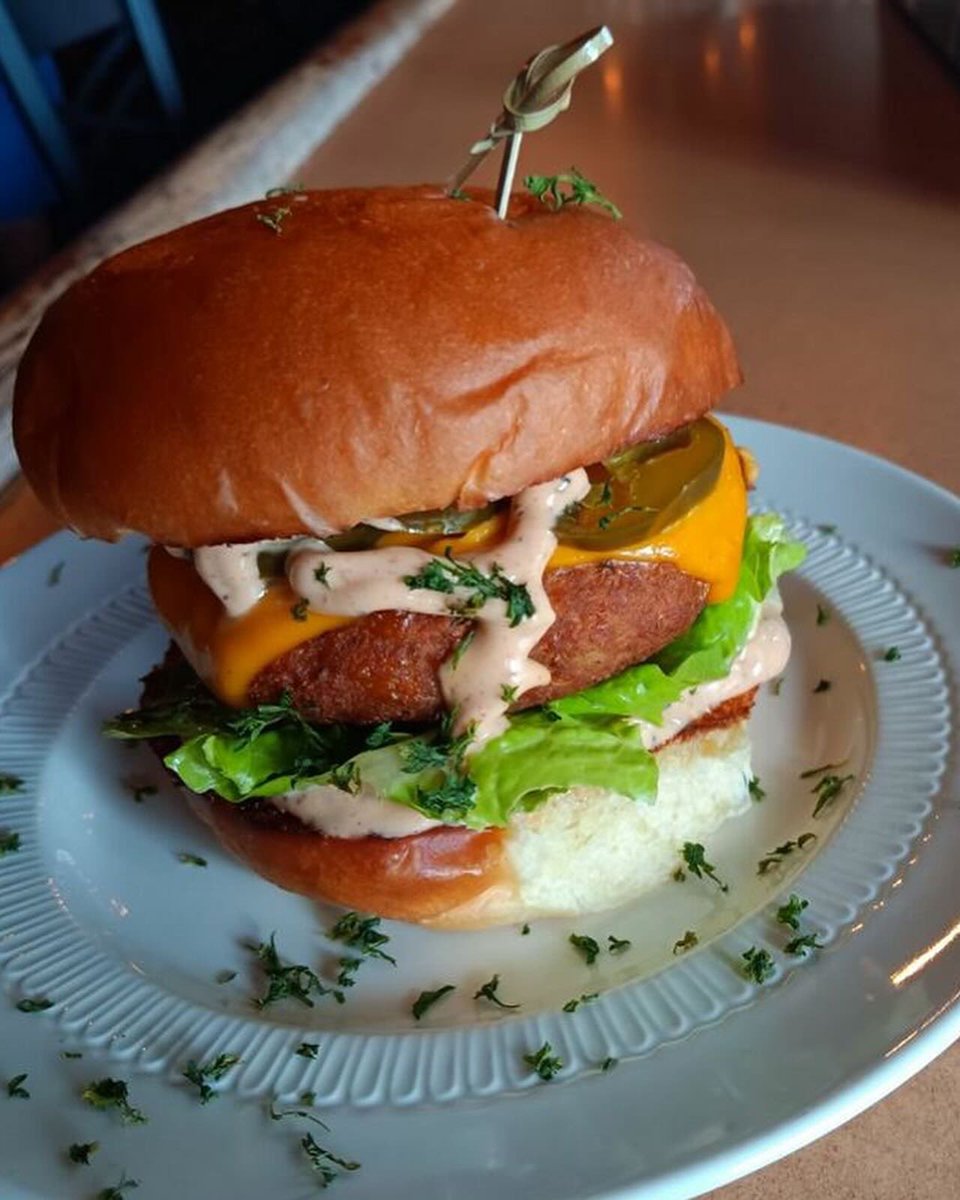 Pierogi Party Patty
- 1 all-beef patty
- Sautéed onions, A1 sour cream
- 2 potato cheddar pierogies
- Topped with more cheddar!

Keep Calm And Curry On
- Deep-fried curry-flavored potato patty
- Vegan cheddar, jalapeños, lettuce, and tomato
- Finished W/ house-made spicy aioli