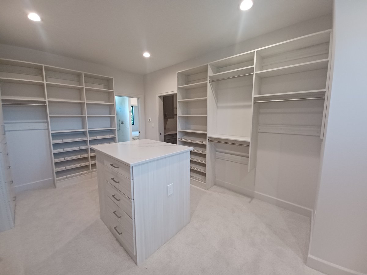 atechinc's tweet photo. custom closet for a new custom home! These clients had an amazing space to work with, giving plenty of space for hanging, shoes, and island, and built-in storage below windows #closetgoals https://t.co/sFgK0FQ7FQ