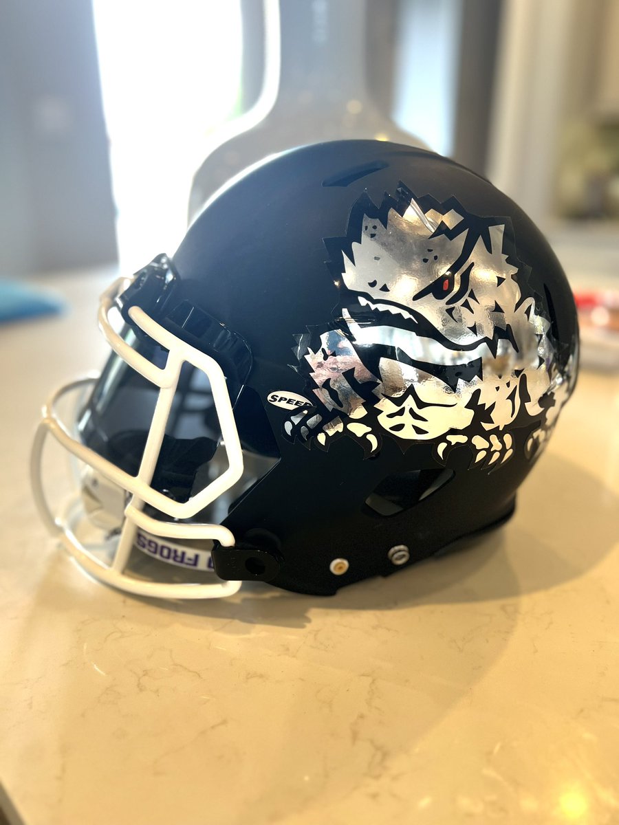 SportsBo's tweet photo. Throwing some ideas around for the TCU black helmets. Not sure which hits harder https://t.co/W5wFhwu2GA