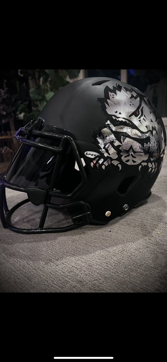 SportsBo's tweet photo. Throwing some ideas around for the TCU black helmets. Not sure which hits harder https://t.co/W5wFhwu2GA