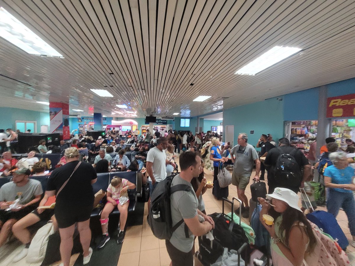 Welcome to the departure hall at Providenciales Airport. Glad I splurged for a AC cooled VIP lounge. This is typical Saturday departures.