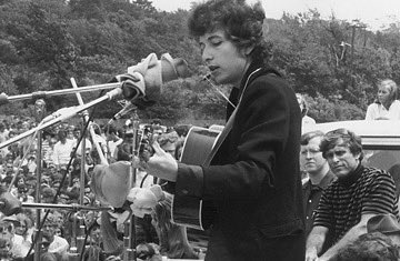 17. Bob Dylan performing at Newport Folk Festival, July 25, 1965.