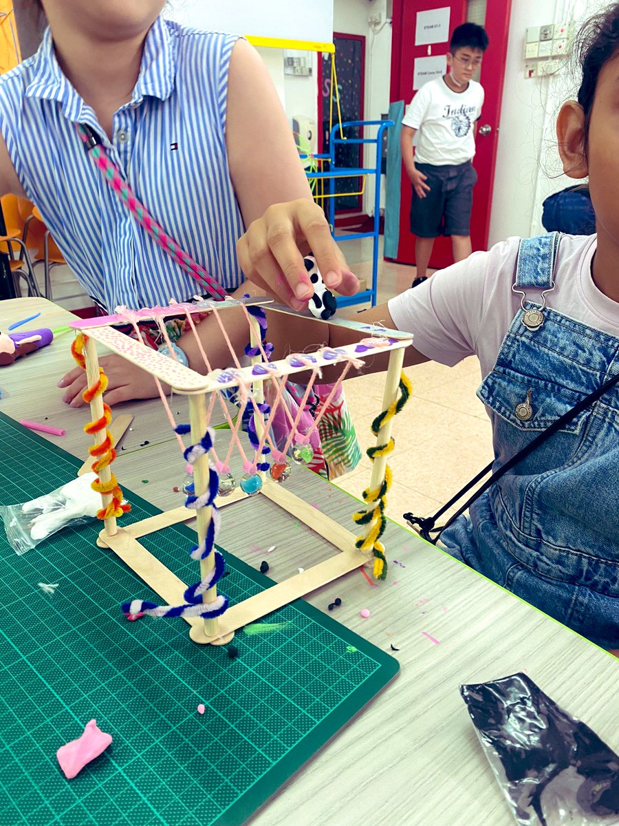 #STEAMcamp, students are learning and applying Newton's Third Law - stating for every action (force) there is an equal and opposite reaction. They are building new #Newton'sCradles, which turned out really creative and cool! #science #physics #engineering <a href="/DSC_EDU/">DSC</a> <a href="/JWalterEDU/">Jason Walter, EdD (he/him)</a>