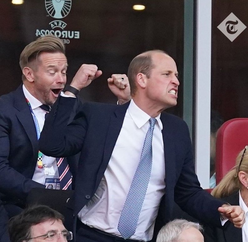 It looks like his wig has blown off and landed on the fella behind him
