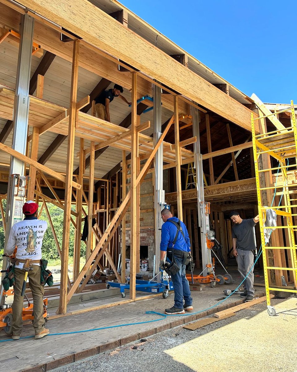DottoCompany's tweet photo. Last week our team set the new ridge beam that spans 46 feet. We installed concealed hangers for each rafter by routing them into the end of each rafter &amp; ridge beam. This takes precision and perfect alignment between the beam and rafters while being 25’ up in the air. https://t.co/f0fNVFiUv7