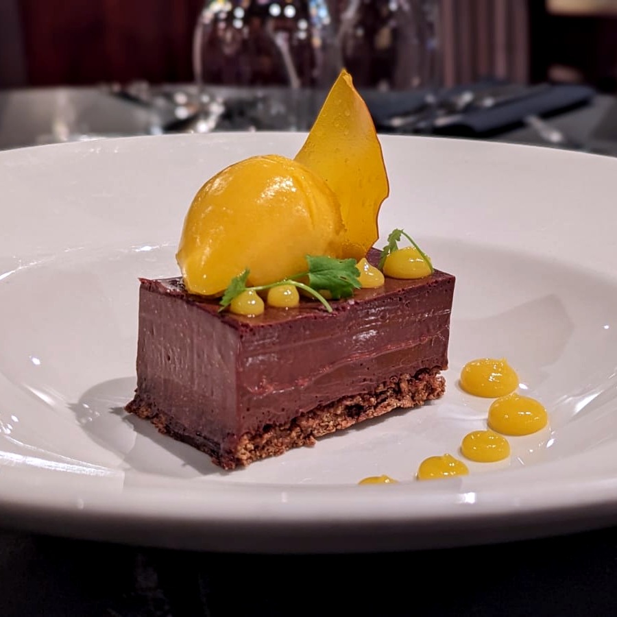 🍫 It's International Chocolate Day!!

All hail the indulgent Chocolate &amp; Hazelnut Delice - We've given it a tropical twist with a fruity Mango Sorbet and Mango Gel 🥭