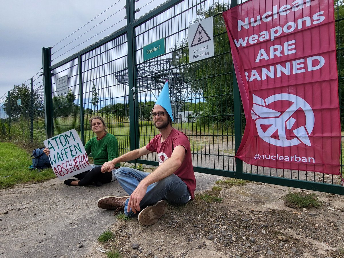 Marvin_M_'s tweet photo. To celebrate 7 years of the adoption of the TPNW, yesterday activists temporarily blocked 7 gates of the Nörvenich airbase. This is where the airplanes responsible for nuclear sharing in Germany are currently stationed. #nuclearban https://t.co/8jzffNAdZl