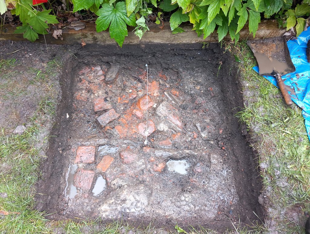 CotswoldArch's tweet image. The #TestPit at Parliament Row, as part of the #BigDig at #Malmesbury, has uncovered a path! We believe this may be the old footpath from when the cottages were first built in 1837. Since then, with many keen gardeners, the ground level has risen, burying the path under about