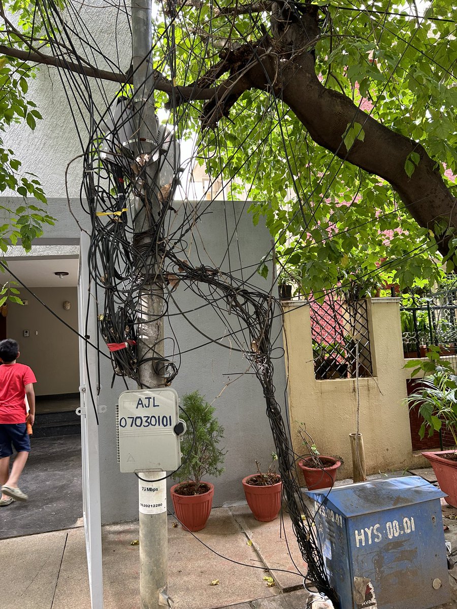 KrupaShamanth's tweet photo. @airtelindia @Airtel_Presence This is the Airtel broadband setup in front our house in Bengaluru. So many low dangling wires and unnecessary https://t.co/oDeCK6qzac is causing lot of inconvenience to us. We have requested n number of times to Airtel representatives to remove them https://t.co/jloaMewrPC