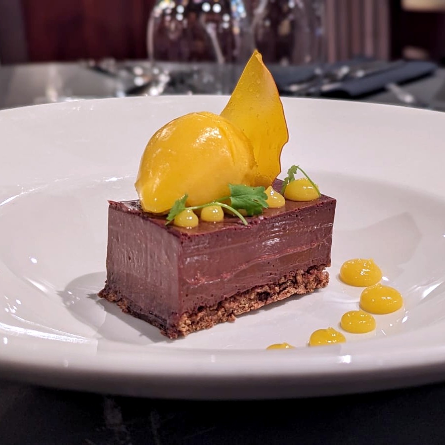 🍫 It's International Chocolate Day!!

All hail the indulgent Chocolate &amp; Hazelnut Delice - We've given it a tropical twist with a fruity Mango Sorbet and Mango Gel 🥭