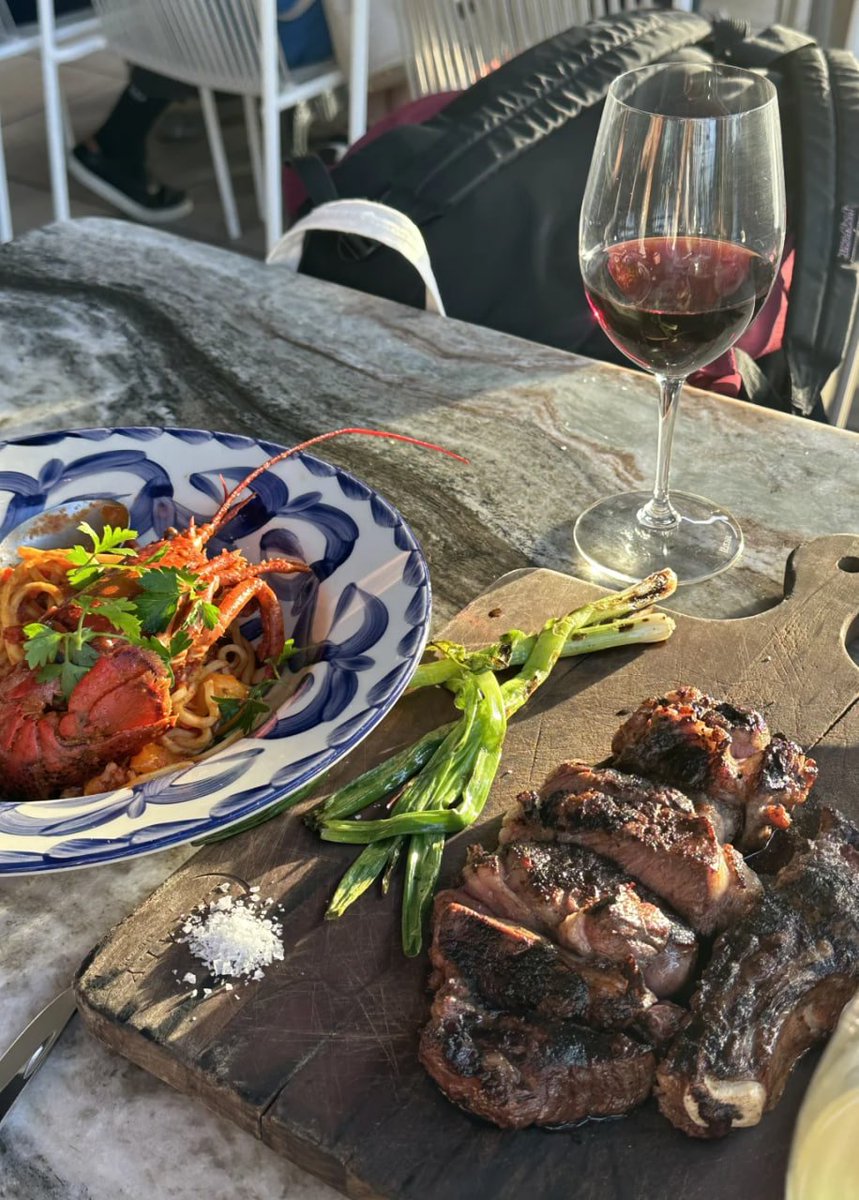 Food and wine at sunset in