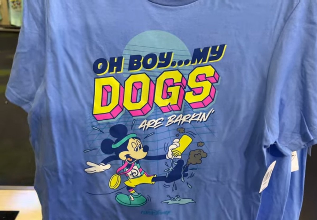 themeparkmoment's tweet image. An official runDisney shirt went viral for its comedic shock value, causing it to sell out quickly and spawn hundreds of counterfeit copies online. (2023)