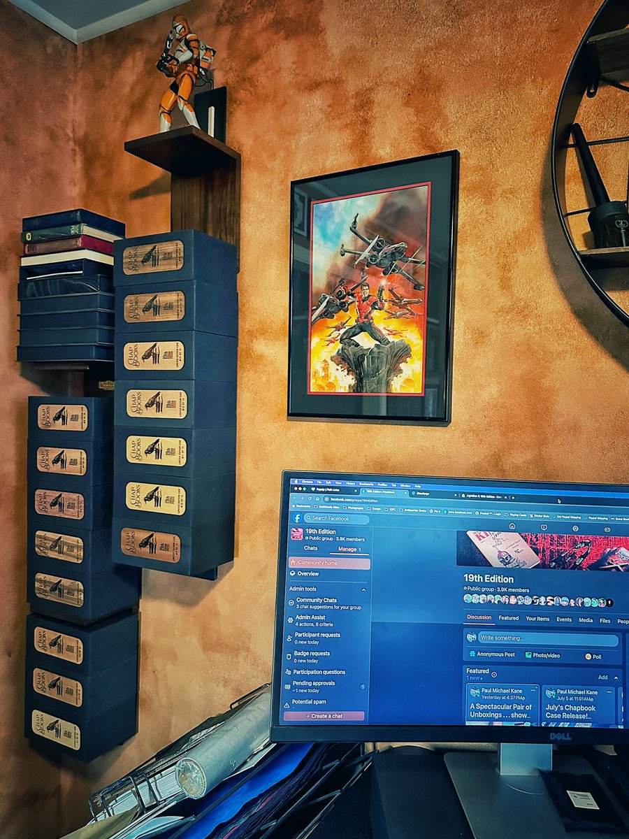 I am doing some design work tonight . . . and I keep glancing up and smiling at the new layout in my office, in particular, my vertical case storage. These shelves hold cases in varying stages of build. Currently, they are overwhelmed by July's Chapbook Case release! #slipcases