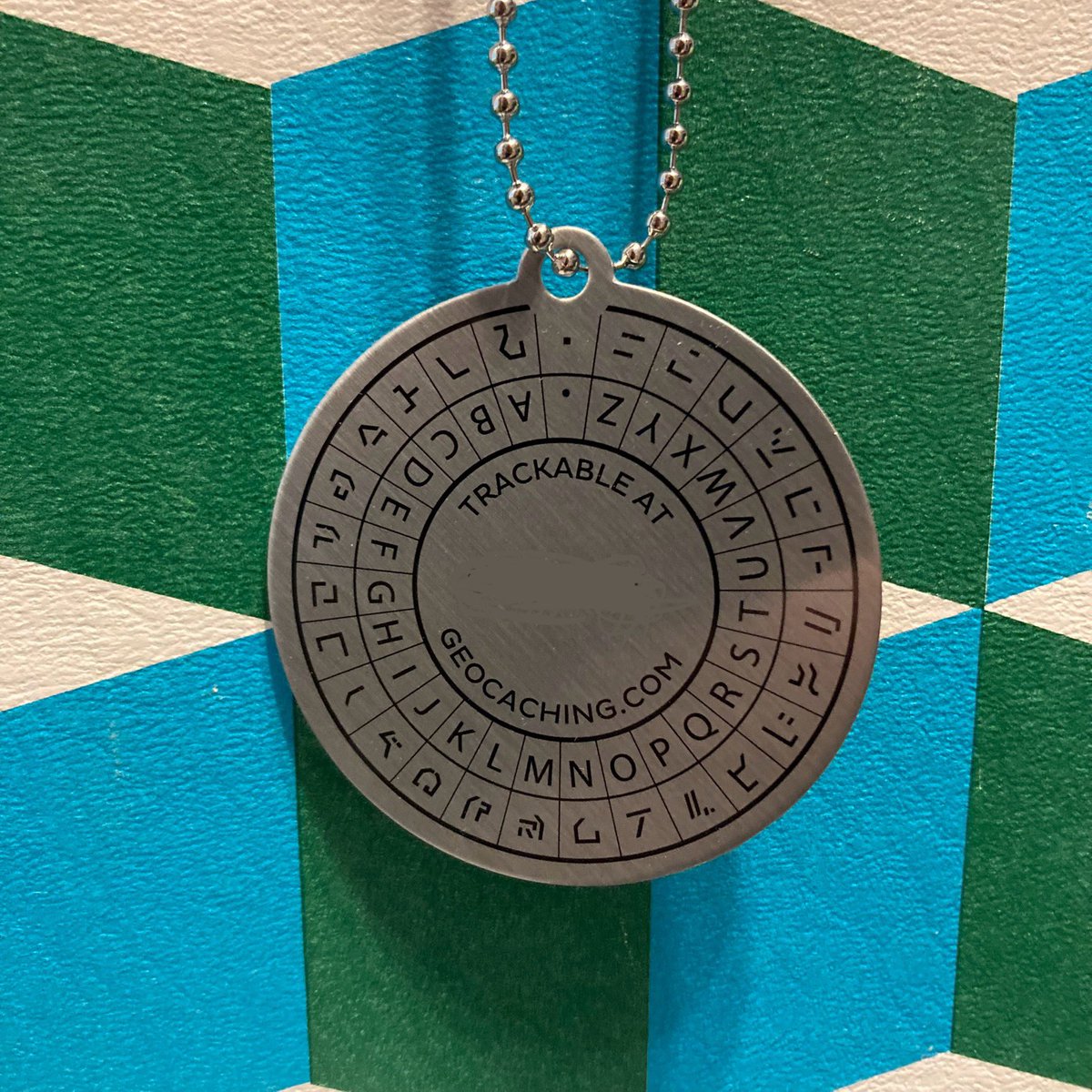 Check out our new trackable, it has a fun decoder on the back. We’re activating ours on 7/25 at our next event to help fuel the .🚀 .Did you get one already on Shop Geocaching? 
Bring yours and activate it there. Didn’t get one? Win one at our next event
GCATTAB.  #geocaching