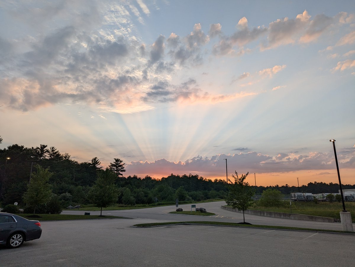 NWSBoston's tweet photo. Mother nature treated many of us to Crepuscular rays this evening, also know as sun rays or sunbeams.  These are created when sunlight shines through gaps in clouds and scatters off dust and haze in the atmosphere. https://t.co/mvdMTgzgPH