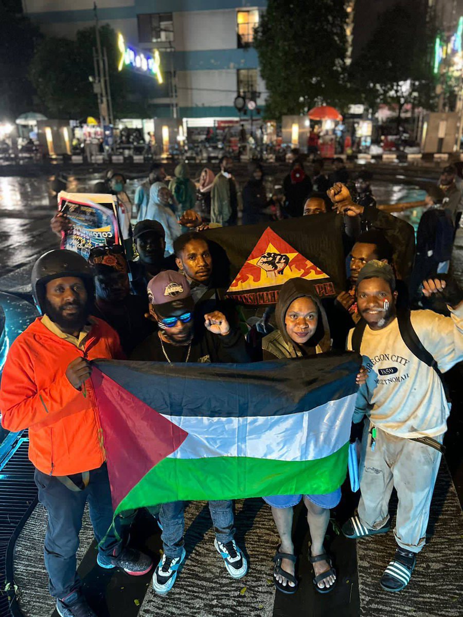 VeronicaKoman's tweet photo. “From Papua to Palestine - smash colonialism”

Solidarity action from West Papuan students in Bandung (Indonesia) for Palestine in the rain last night. https://t.co/zg2KuV3Dk5