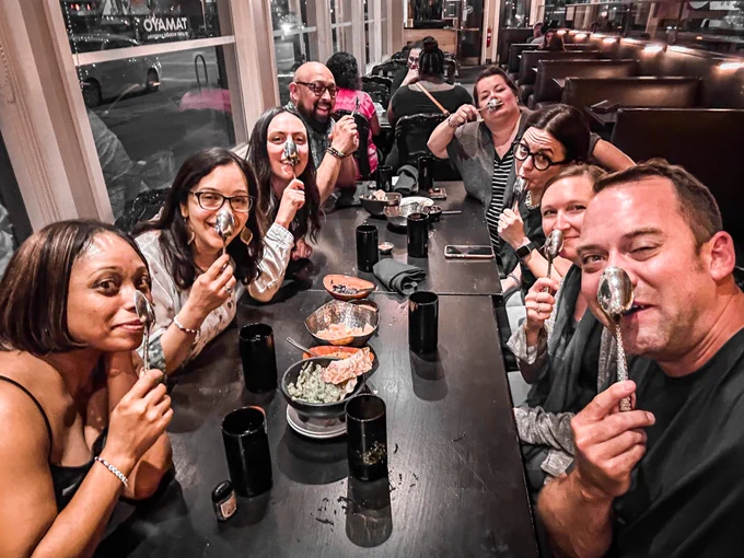 Microsoft Flip/Learning Team at a resultant table with spoons on their nose