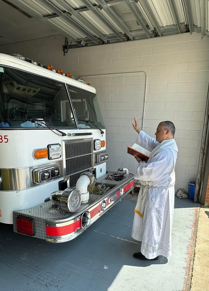 Sachinettiyil's tweet image. A Catholic priest blesses a fire department vehicle in Jackson, Tennessee