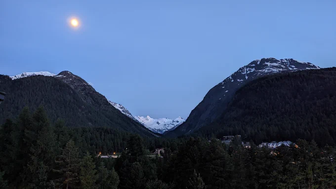 Two snowy montains under the moonlight in Switzerland