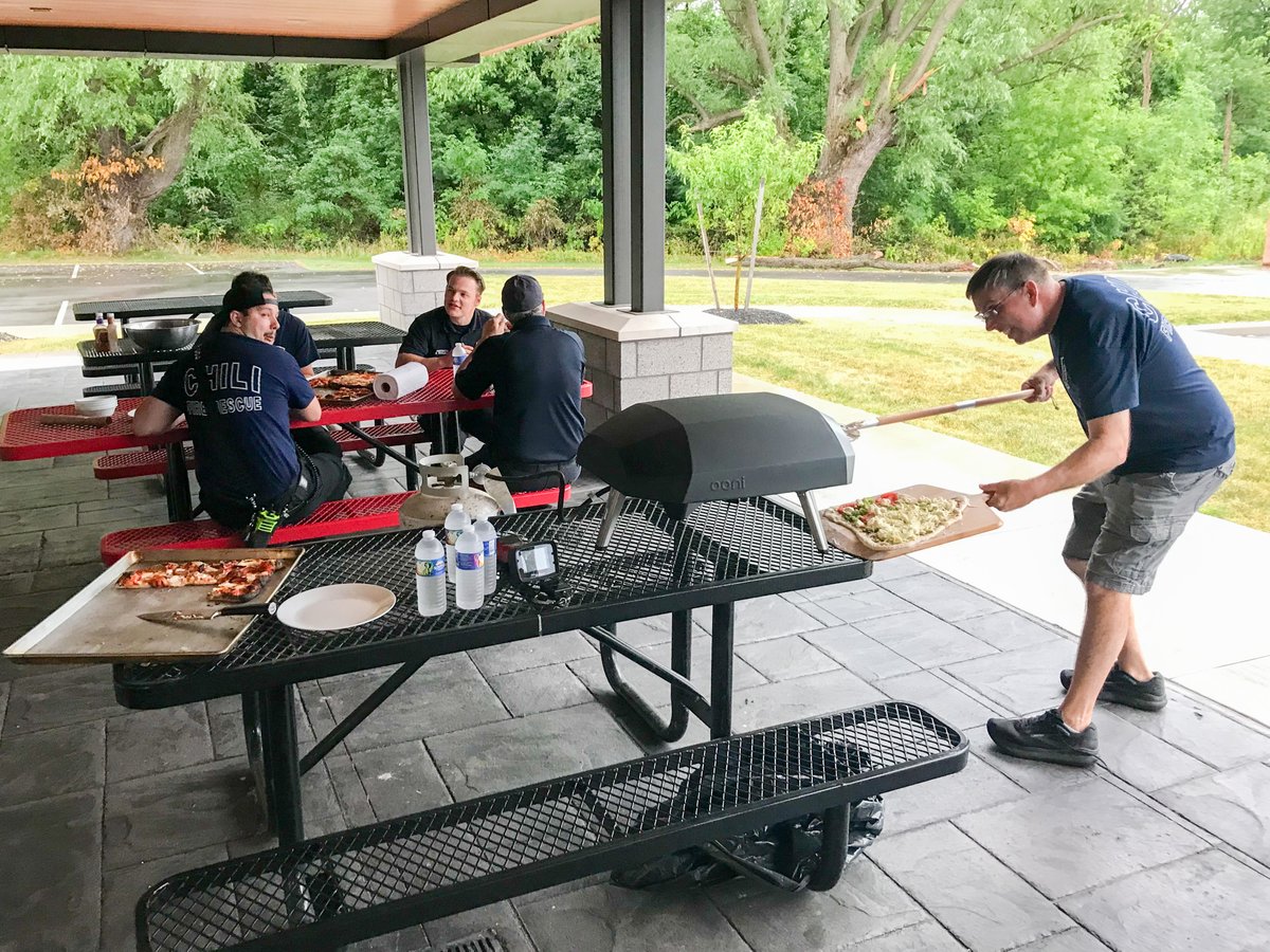ChiliFireDept's tweet photo. A "slice" of life from tonight's bunk-in: Chili firefighters cooked homemade pizzas between emergency calls. Our regular overnight duty crews offer our volunteers a convenient way to respond to calls, reduce response times for the town, and socialize. https://t.co/s6Mu5mNbKw