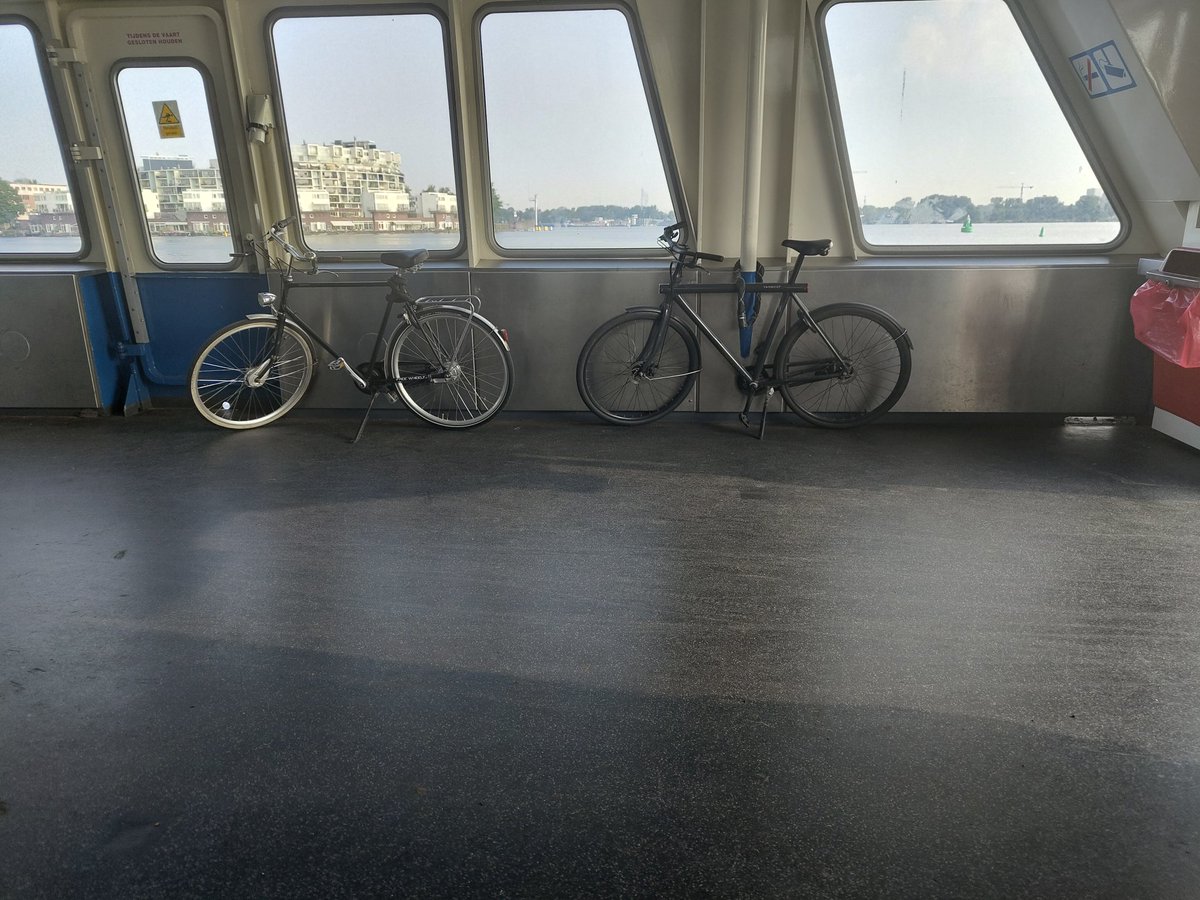 NoShirtSherlock's tweet photo. Never considered the Dutchness of taking my bike on a little boat across the water https://t.co/YJStfrWjZn