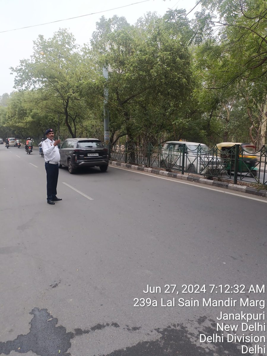 Traffic regulation by staff of Western Range in morning