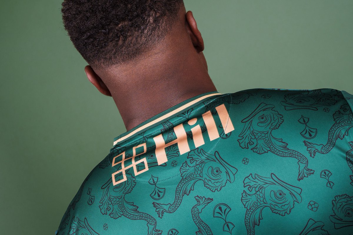 Inspired by Reality Checkpoint of Parker's Piece, the Third Shirt features heraldic dolphins along with flower and leaf motifs.