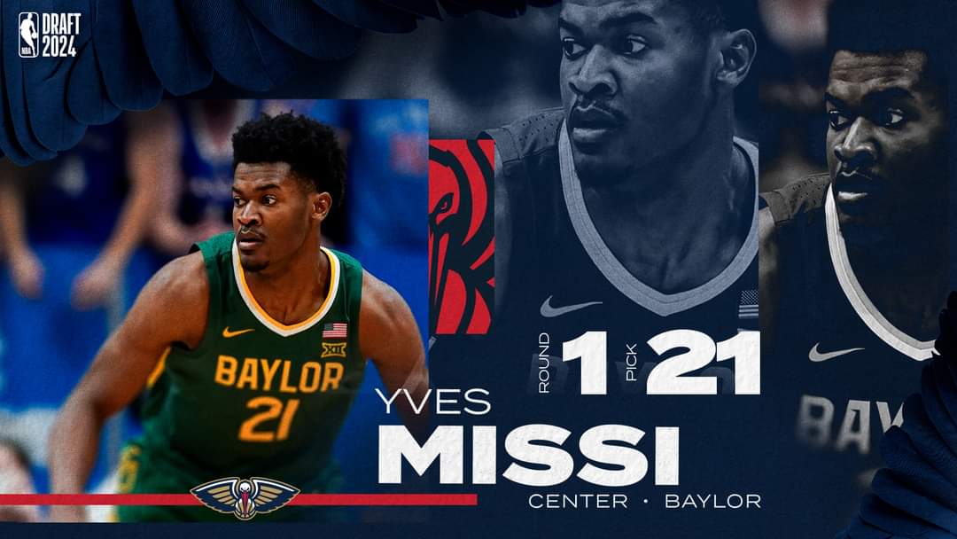 GOAT__plus's tweet photo. #GoBasket 🏀

Yves Missi a été le 21e choix de la #draft 2024. Il rejoint ainsi New Orleans Pelicans.
Dans sa veste, on peut lire la Maxime "Ora et Labora" en hommage à Vogt où il est passé, ainsi que le logo du continent 🇨🇲 et la tête d'un lion. #CamerNproud 
#ballislife https://t.co/8xaOB42X4D