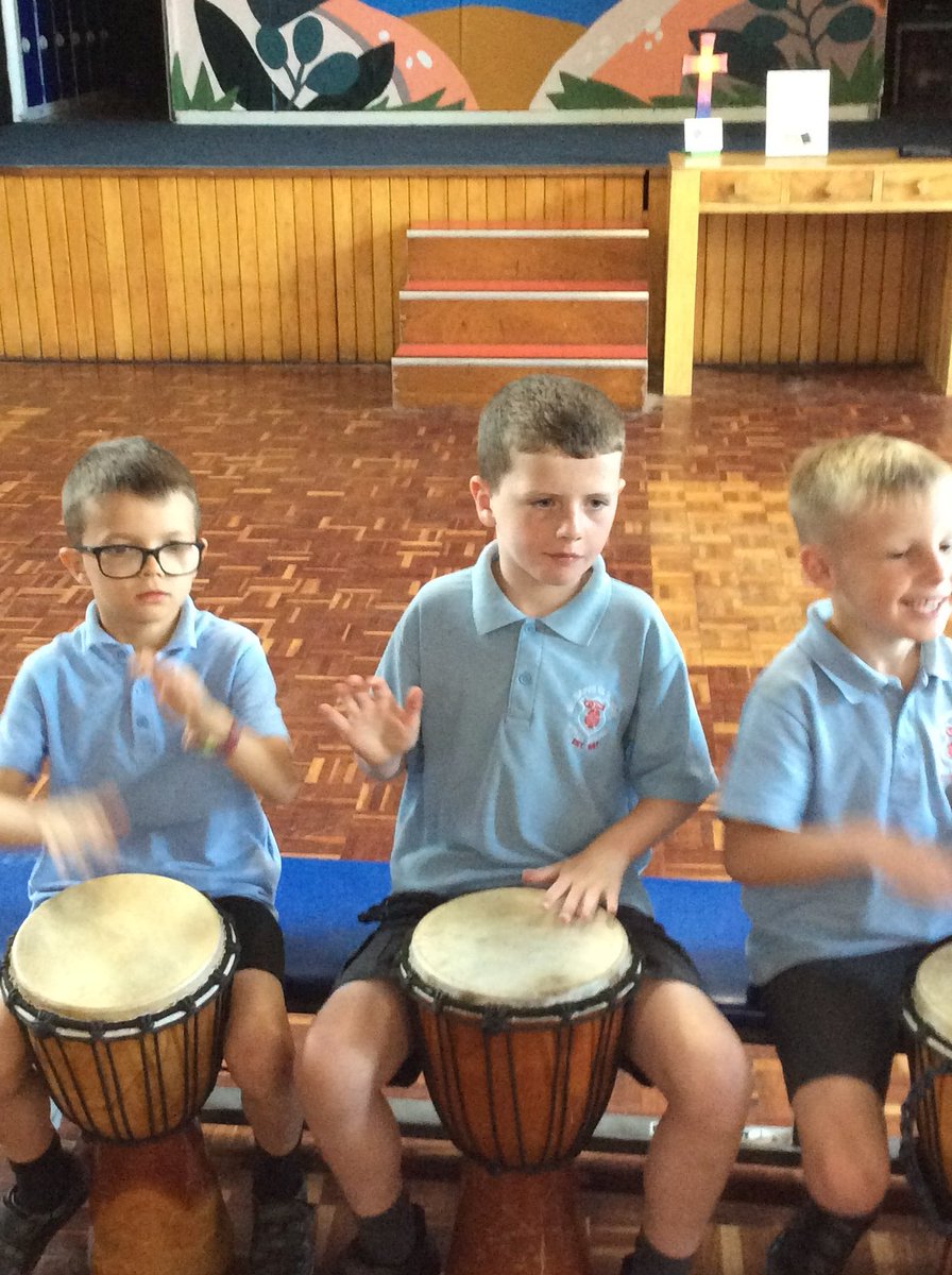 AppleySaintsCE's tweet photo. #ABASY2 concentrating hard to play the djembe drums. Here they are practicing their dun and their ka! @WorldMusicDays @WN6_Mums @StandishVoice @WigToday @FriendsPrimary https://t.co/ncYgtX650M
