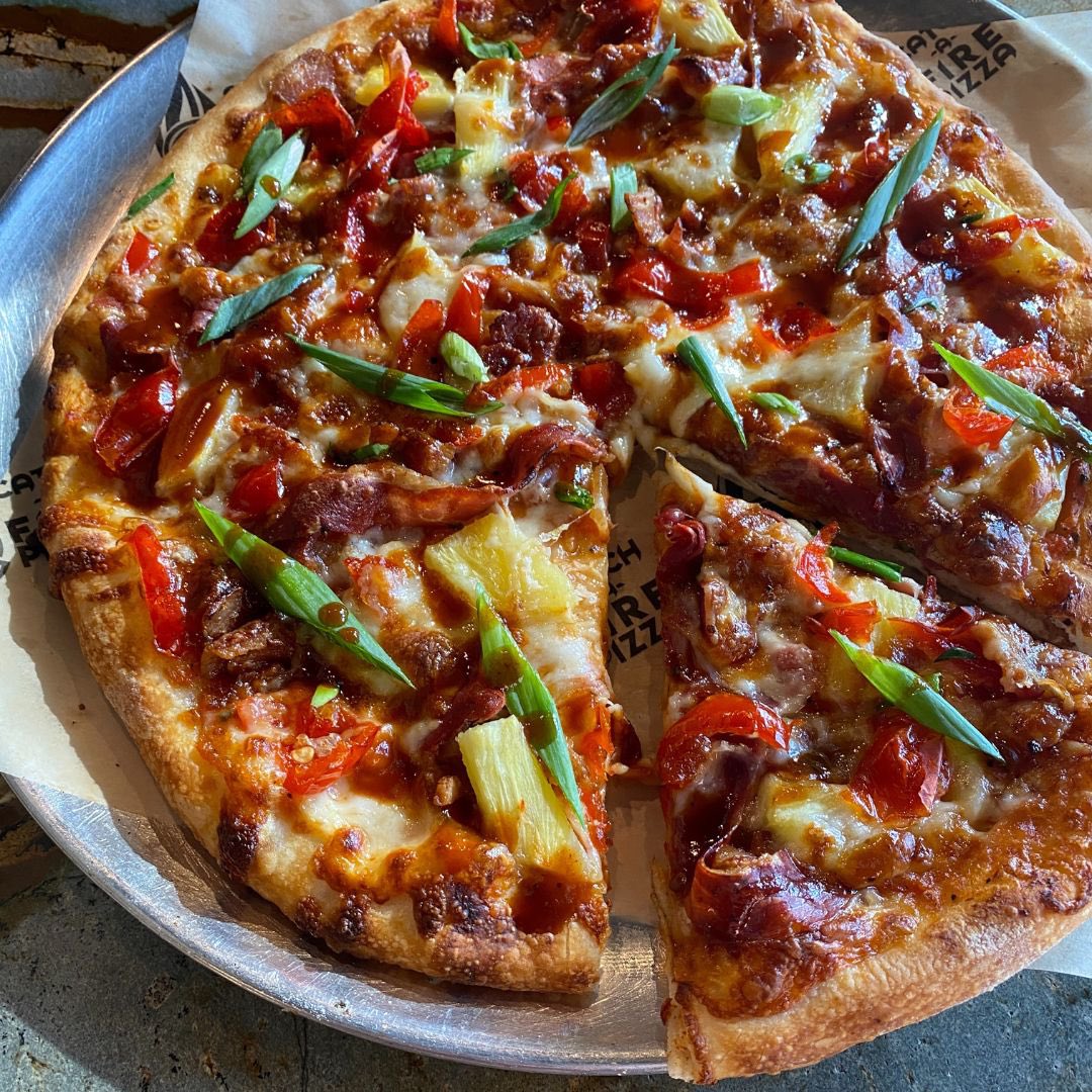 Catch-a-Fire Pizza (@catchafirepizza) on Twitter photo Celebrate the release of @westsidebrewing Pineapple Cider at our WESTWOOD location with our Hawaiian pizza, the Lively Up Yourself! Bright & flavorful, this pizza features fire-roasted red sauce, bacon, prosciutto, peppadews, fresh pineapple, four cheeses, BBQ sauce & scallion. Celebrate the release of @westsidebrewing Pineapple Cider at our WESTWOOD location with our Hawaiian pizza, the Lively Up Yourself! Bright & flavorful, this pizza features fire-roasted red sauce, bacon, prosciutto, peppadews, fresh pineapple, four cheeses, BBQ sauce & scallion.
