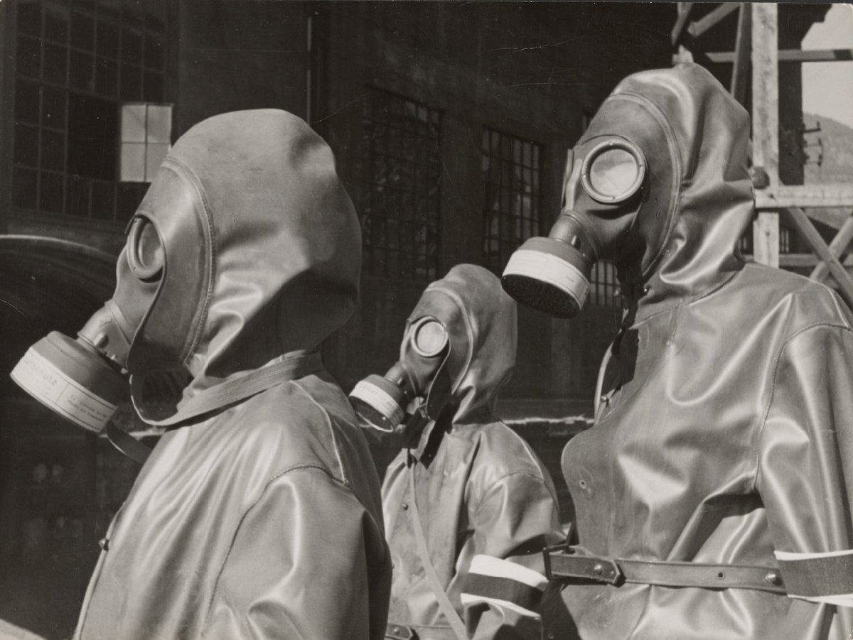 [Three figures in gas masks]1937-1945In 1944, Dr. Paul Wolffâs negative archive burned when his home in Frankfurt was bombed by the allies. When Paul Wolff died in 1951, his wife Annette Wolff took over the archive, and sold what prints remained.