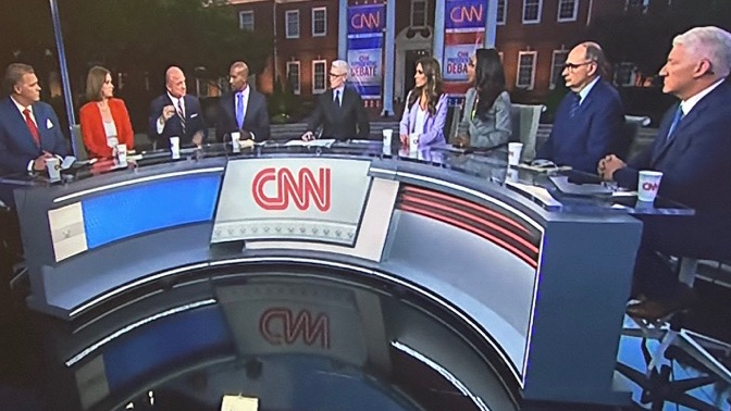 CNN should try putting one more person at this desk.