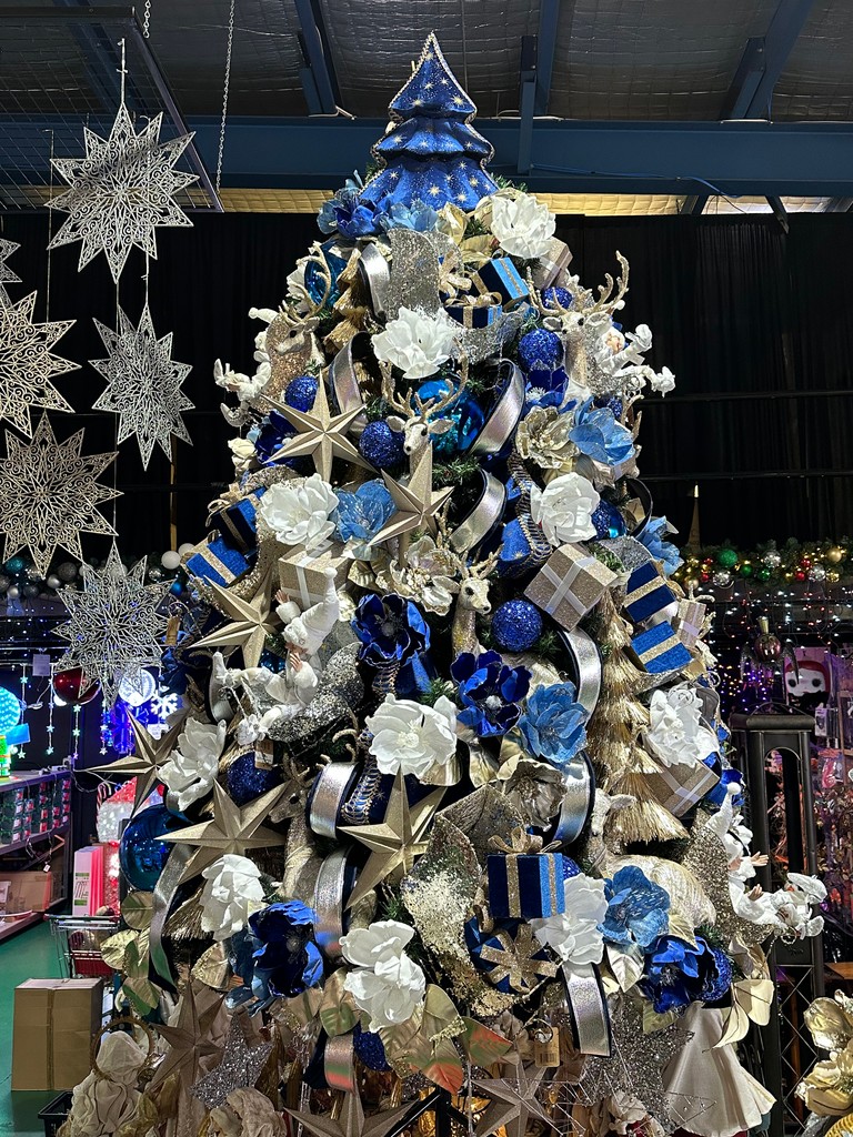 Blue has long been a religious colour and we’ve used royal blue and sky blue in our new Christmas tree “Starlight”. Larger character pieces like fabric brocade reindeers and sequinned sleighs add a metallic contrast.