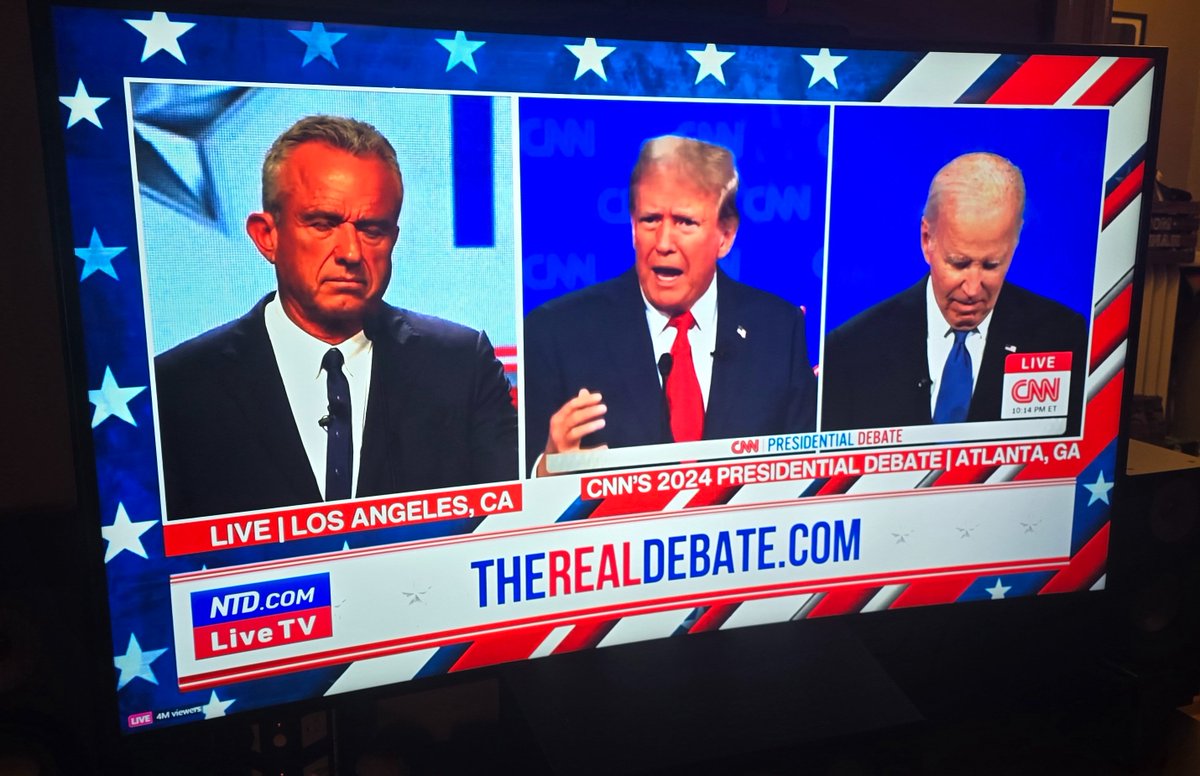 thetomzone's tweet photo. If that debate wasn't insane enough for you, RFK Jr. spent the evening doing a competing live stream where he spliced himself into the feed and took separate questions from a guy that looks like he killed a moderator and stole his clothes https://t.co/AQHAnjIRmi
