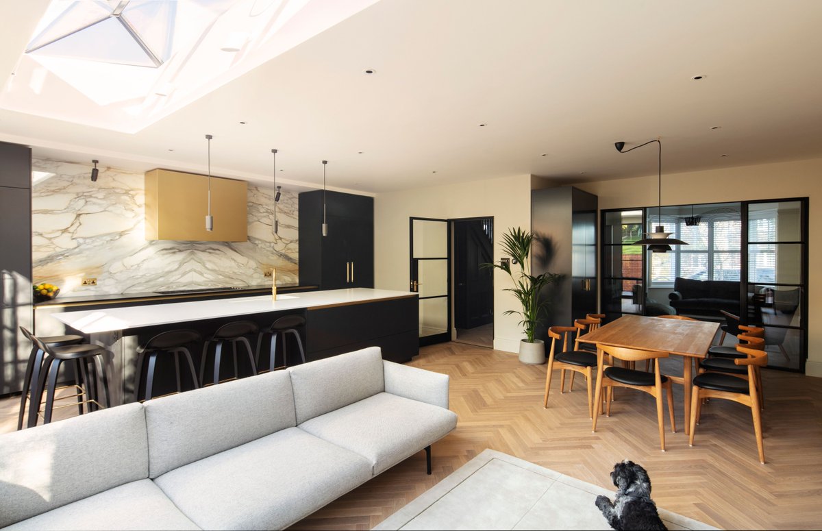 Enhanced spaciousness, increased natural light access, perfect for entertaining. There are numerous advantages to having an open-concept kitchen and living space, much like this one, cherished by the homeowners... and their beloved pets! #interiorarchitecture #fineinteriors