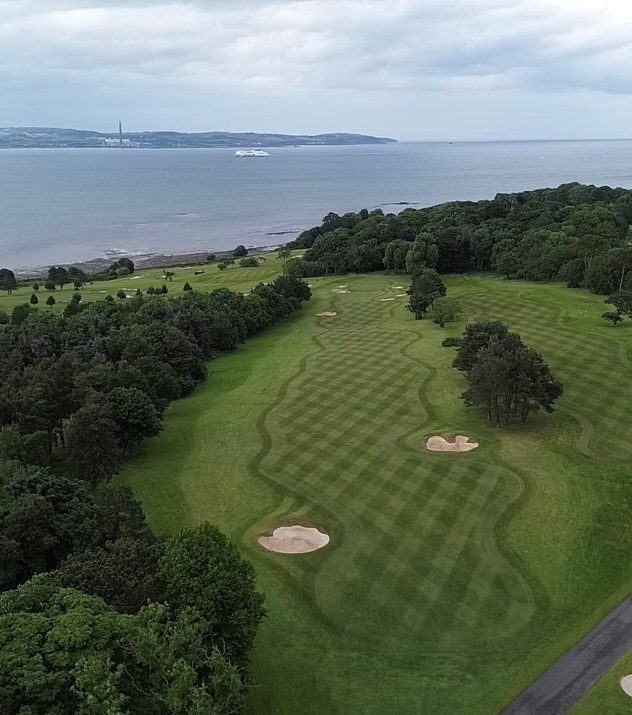 The par 5, 5th hole. A good drive to the right portion of the fairway is required to reach the green in 2. The longest hole on the course and one of 3 holes which crosses the meandering driveway through the course. #golf #northernireland #ireland