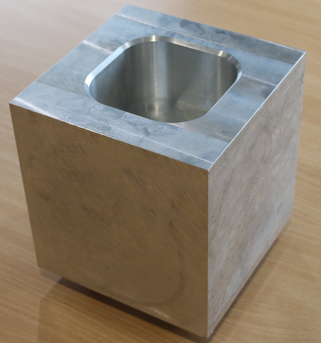 Aluminium cube prepared and ready for 4thaxis production! Stay tuned to see the end results #4thaxis #Engineering #johngriffiths